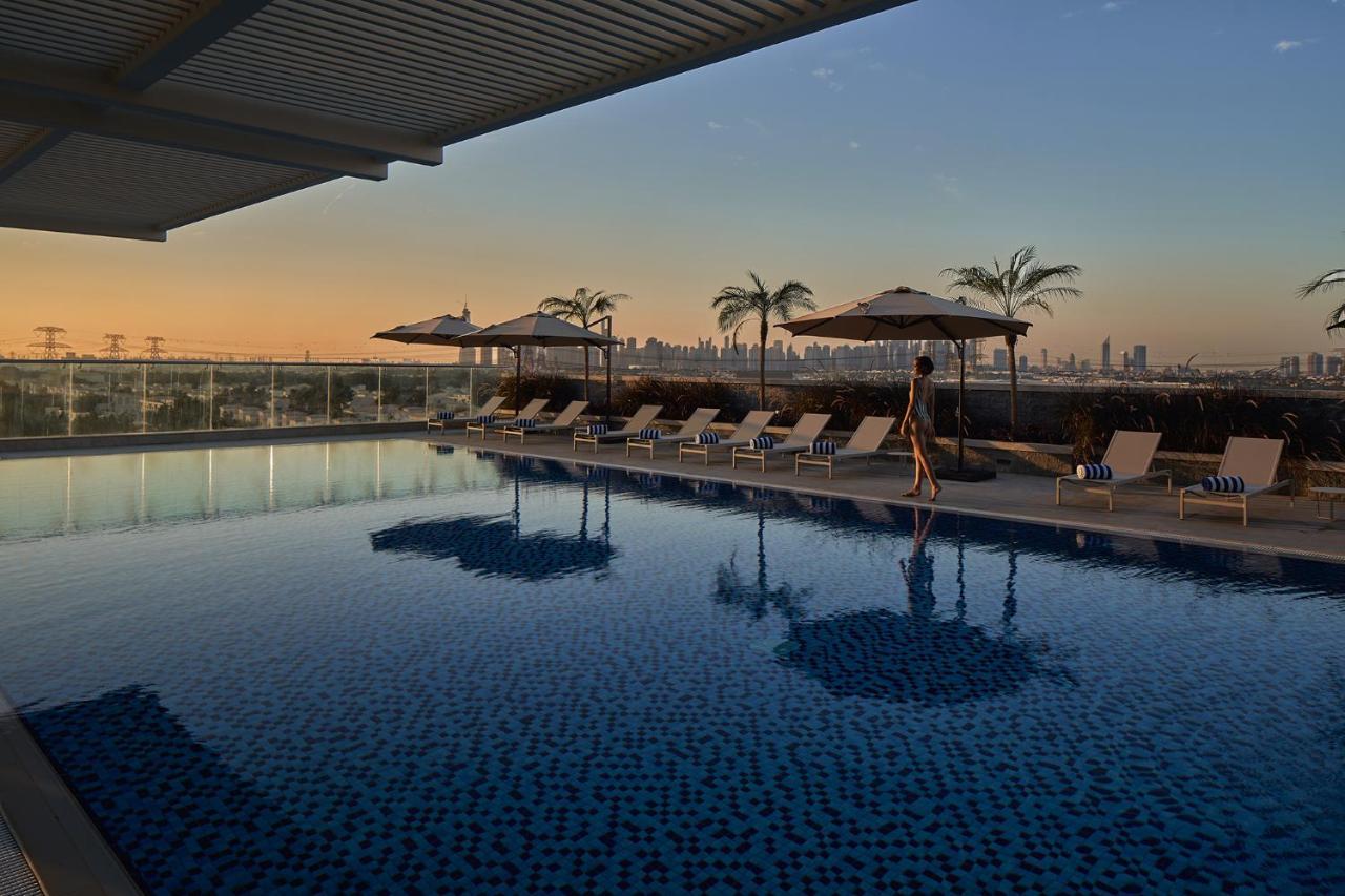 Movenpick Jumeirah Village Triangle Дубай Экстерьер фото The rooftop pool at the hotel